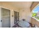 Charming balcony with seating and sliding glass doors, providing a peaceful outdoor retreat at 6480 Annie Oakley Dr # 624, Las Vegas, NV 89120