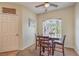 Charming dining area with a dark wooden table set by a window, featuring a ceiling fan at 6480 Annie Oakley Dr # 624, Las Vegas, NV 89120