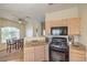 Bright kitchen featuring granite countertops, stainless steel appliances, and an adjacent dining area at 6480 Annie Oakley Dr # 624, Las Vegas, NV 89120