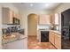 Well-equipped kitchen with stainless steel appliances, granite countertops, and light wood cabinets at 6480 Annie Oakley Dr # 624, Las Vegas, NV 89120