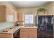 Modern kitchen featuring granite countertops, stainless steel appliances, and ample cabinet space at 6480 Annie Oakley Dr # 624, Las Vegas, NV 89120