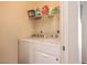 Convenient laundry area with appliances and shelving, providing functionality and storage for laundry needs at 6480 Annie Oakley Dr # 624, Las Vegas, NV 89120