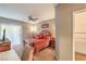 Comfortable main bedroom with a decorative bed, dresser with TV, ceiling fan, and sliding glass door to the patio at 6480 Annie Oakley Dr # 624, Las Vegas, NV 89120