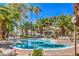 Community pool with lounge chairs, offering a relaxing and enjoyable amenity for residents to gather at 6480 Annie Oakley Dr # 624, Las Vegas, NV 89120
