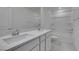 Bright bathroom featuring a shower-tub combo, modern vanity, and neutral color palette at 681 Stone Hammer Ave, Las Vegas, NV 89183