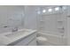 Bathroom with shower-tub combo, modern vanity, and neutral color palette at 681 Stone Hammer Ave, Las Vegas, NV 89183