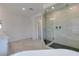 Stylish bathroom featuring a luxurious freestanding tub, a spacious glass shower, and a double vanity with stone countertop at 681 Stone Hammer Ave, Las Vegas, NV 89183