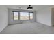 Bedroom with three large windows and neutral carpet at 681 Stone Hammer Ave, Las Vegas, NV 89183