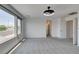 Spacious bedroom with large windows, modern lighting fixture, and neutral color palette, offering a bright and airy feel at 681 Stone Hammer Ave, Las Vegas, NV 89183