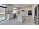 Modern kitchen features stainless steel appliances, white cabinets and quartz countertops at 681 Stone Hammer Ave, Las Vegas, NV 89183
