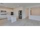 Bright modern kitchen with white cabinets, stainless steel appliances and kitchen island at 681 Stone Hammer Ave, Las Vegas, NV 89183