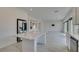 Bright and airy kitchen with a central island, stainless steel appliances and tile flooring at 681 Stone Hammer Ave, Las Vegas, NV 89183