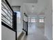 Bright living room featuring tile floors, recessed lighting and staircase at 681 Stone Hammer Ave, Las Vegas, NV 89183
