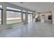 Bright open space with tile floors, large windows, and seamless connection to the modern kitchen at 681 Stone Hammer Ave, Las Vegas, NV 89183