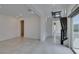 Open-concept living room featuring tile flooring, recessed lights, and staircase at 681 Stone Hammer Ave, Las Vegas, NV 89183