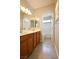 Bathroom with double sink vanity, neutral walls, and a shower-tub combo at 7089 Oberling Bay Ave, Las Vegas, NV 89113