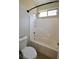 Clean bathroom featuring a shower-tub combination and window at 7089 Oberling Bay Ave, Las Vegas, NV 89113