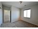 This bedroom includes natural light and neutral walls and carpet at 7089 Oberling Bay Ave, Las Vegas, NV 89113