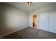 Neutral bedroom featuring a spacious closet and an open doorway to the bathroom at 7089 Oberling Bay Ave, Las Vegas, NV 89113