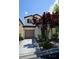 Charming two-story home featuring a well-manicured front yard and attached garage at 7089 Oberling Bay Ave, Las Vegas, NV 89113