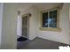 Inviting front porch with decorative features and a secure screen door entrance at 7089 Oberling Bay Ave, Las Vegas, NV 89113