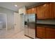 The kitchen features stainless steel refrigerator and a pantry at 7089 Oberling Bay Ave, Las Vegas, NV 89113