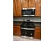 The kitchen features stainless steel appliances and wood cabinets at 7089 Oberling Bay Ave, Las Vegas, NV 89113