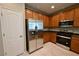 A kitchen featuring stainless steel refrigerator, a pantry, and gas range at 7089 Oberling Bay Ave, Las Vegas, NV 89113