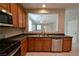 A kitchen with stainless appliances and wood cabinetry at 7089 Oberling Bay Ave, Las Vegas, NV 89113
