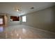Open-concept living room, with modern lighting and view to the kitchen at 7089 Oberling Bay Ave, Las Vegas, NV 89113