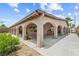 Expansive covered back patio featuring an arched design and plenty of room for outdoor relaxation at 8021 Yellow Daisy Ave, Las Vegas, NV 89147
