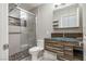 Bathroom with a glass enclosed shower, unique vanity and modern fixtures and decor at 8021 Yellow Daisy Ave, Las Vegas, NV 89147