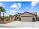 Charming single-story home with well-manicured landscaping, desert flora, and inviting curb appeal at 8021 Yellow Daisy Ave, Las Vegas, NV 89147