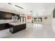 Modern kitchen with a large center island, sleek cabinetry, and stainless steel appliances at 8021 Yellow Daisy Ave, Las Vegas, NV 89147