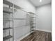 Spacious walk-in closet with custom metal shelving, providing ample storage at 8021 Yellow Daisy Ave, Las Vegas, NV 89147