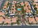 Community aerial view highlighting beautiful landscaping, swimming pool, and multiple residential buildings at 8409 Running Deer Ave # 203, Las Vegas, NV 89145