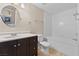 Bright bathroom featuring a vanity with ample storage and a combination tub and shower at 8409 Running Deer Ave # 203, Las Vegas, NV 89145
