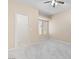 Cozy carpeted bedroom features a window and a doorway leading to another room at 8409 Running Deer Ave # 203, Las Vegas, NV 89145