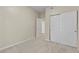 Bedroom featuring neutral carpet and closet with paneled doors at 8409 Running Deer Ave # 203, Las Vegas, NV 89145
