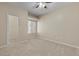 Bedroom featuring neutral carpet, a window, and an entry door at 8409 Running Deer Ave # 203, Las Vegas, NV 89145