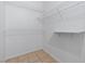 Walk-in closet with wire shelving for organized storage and tile floors at 8409 Running Deer Ave # 203, Las Vegas, NV 89145