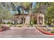 Exterior shot of the neighborhood clubhouse with well maintained landscaping at 8409 Running Deer Ave # 203, Las Vegas, NV 89145