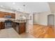 Well-lit kitchen featuring wood cabinets and stainless steel appliances with tile floors at 8409 Running Deer Ave # 203, Las Vegas, NV 89145