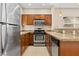 Kitchen features granite counters, tile floors and stainless appliances at 8409 Running Deer Ave # 203, Las Vegas, NV 89145