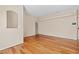 Spacious living room with hardwood floors and neutral walls with a built-in display niche at 8409 Running Deer Ave # 203, Las Vegas, NV 89145