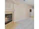 Living room with a neutral carpet and a cozy fireplace to add style to the space at 8409 Running Deer Ave # 203, Las Vegas, NV 89145