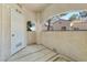 Outdoor patio provides a relaxed setting with views of the community, featuring a concrete floor and textured walls at 8409 Running Deer Ave # 203, Las Vegas, NV 89145