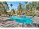Community pool with well maintained landscaping and a community hot tub at 8409 Running Deer Ave # 203, Las Vegas, NV 89145
