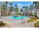 Community pool featuring a resort-style living with palm trees at 8409 Running Deer Ave # 203, Las Vegas, NV 89145