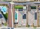 Aerial view of a home with a pool, outdoor living space, solar panels, and manicured lawns at 8668 Hartmont St, Las Vegas, NV 89166